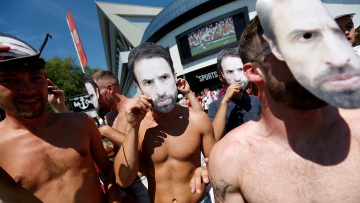 England fans wearing Gareth Southgate masks.